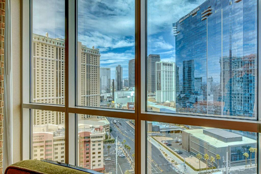 a view of a city skyline from a window at Luxurious MGM Strip View 07605 Balcony in Las Vegas