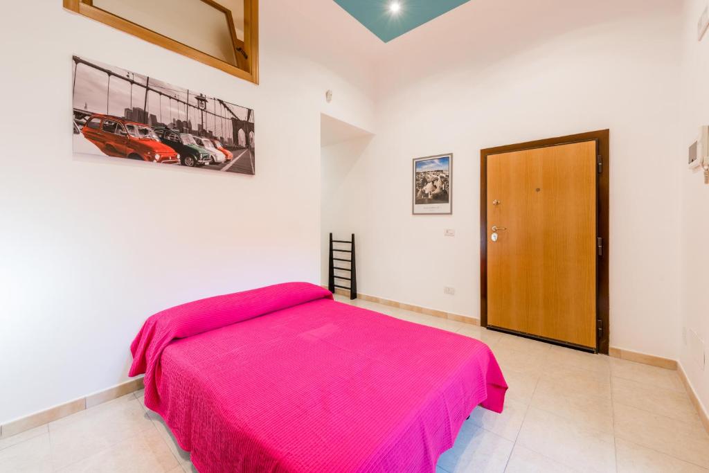 Postel nebo postele na pokoji v ubytování Bari Design City Centre Casatuabari