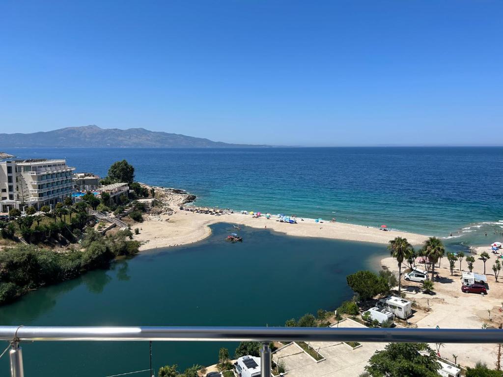 a view of a beach and the ocean at Sea view apartament in Sarandë