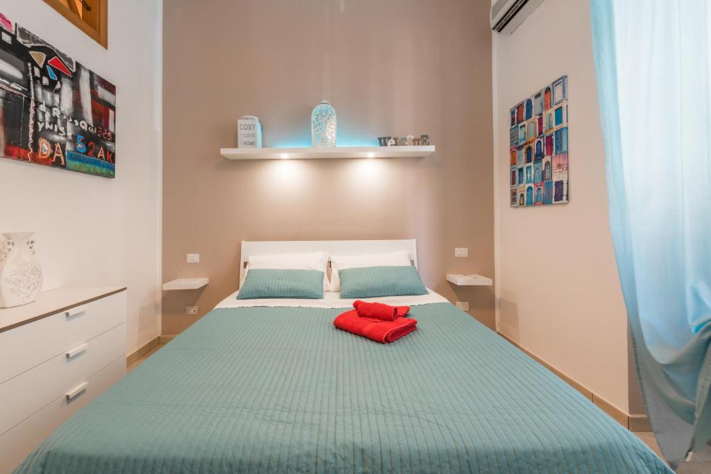 Postel nebo postele na pokoji v ubytování Bari Design City Centre Casatuabari