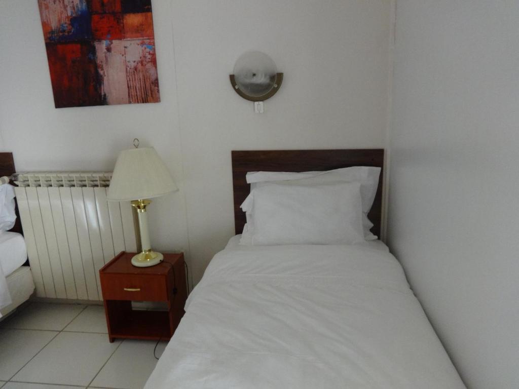 Postel nebo postele na pokoji v ubytování Matic Apartments