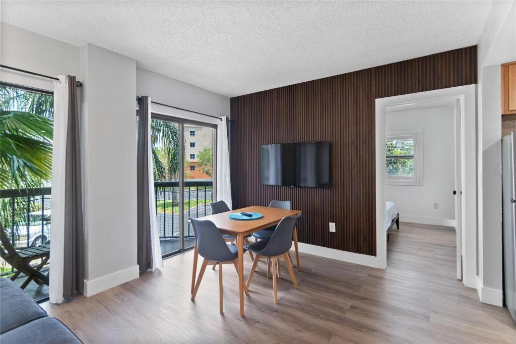 a dining room with a table and chairs in a room at JS Luxury Vacation in Orlando