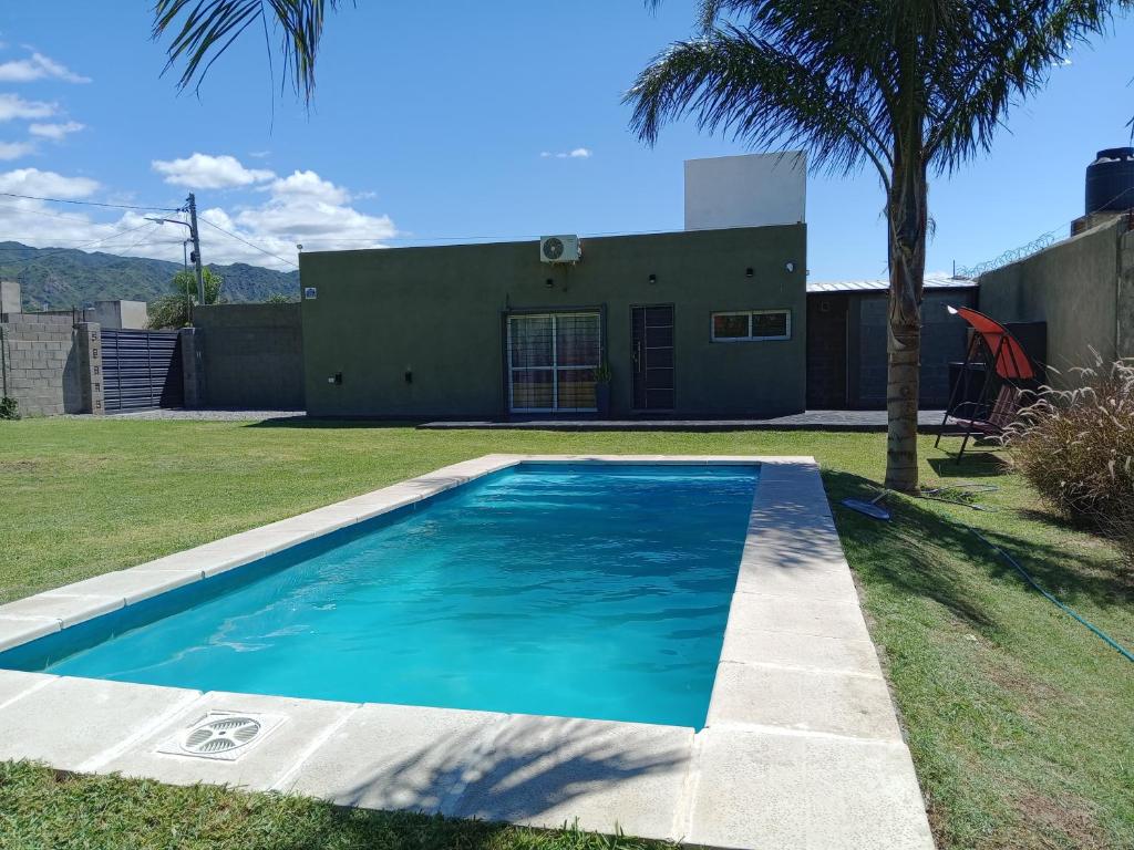a swimming pool in the yard of a house at Lomas del Mirador in San Fernando del Valle de Catamarca