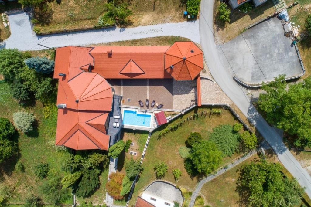 an overhead view of a house with a swimming pool at Family friendly house with a swimming pool Benkovec, Zagorje - 24902 in Bednja