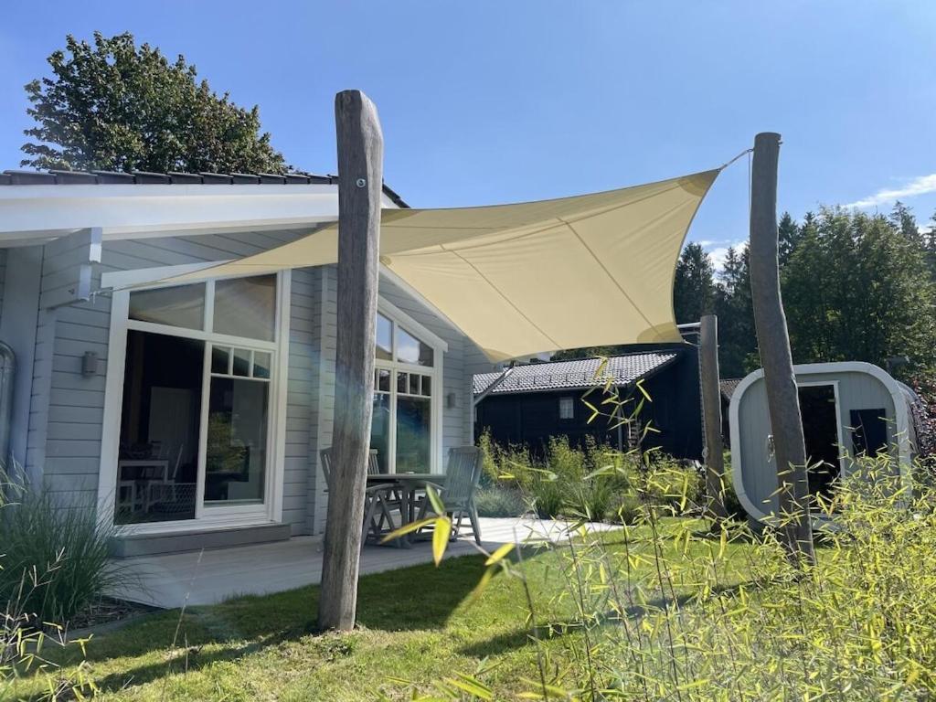a screened in porch with a tent on top of a house at Holiday apartment with 2 bedrooms in Clausthal-Zellerfeld