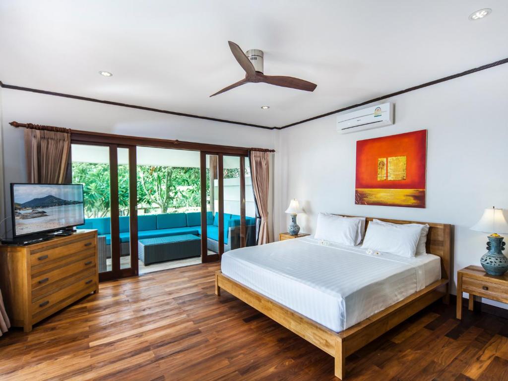 Postel nebo postele na pokoji v ubytování Idyllic Samui Beach Villa Resort