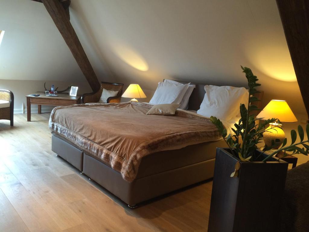 Postel nebo postele na pokoji v ubytování Hotel Dufays