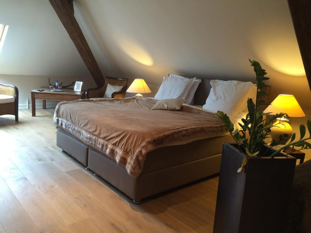 Postel nebo postele na pokoji v ubytování Hotel Dufays