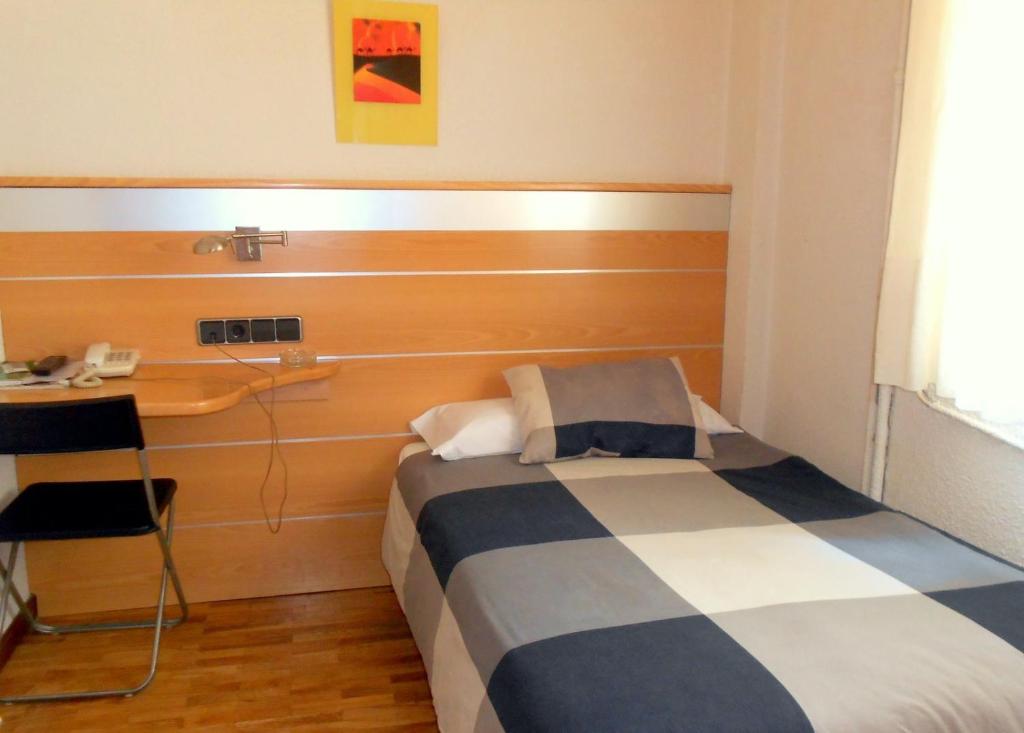 Postel nebo postele na pokoji v ubytování Hotel Trefacio