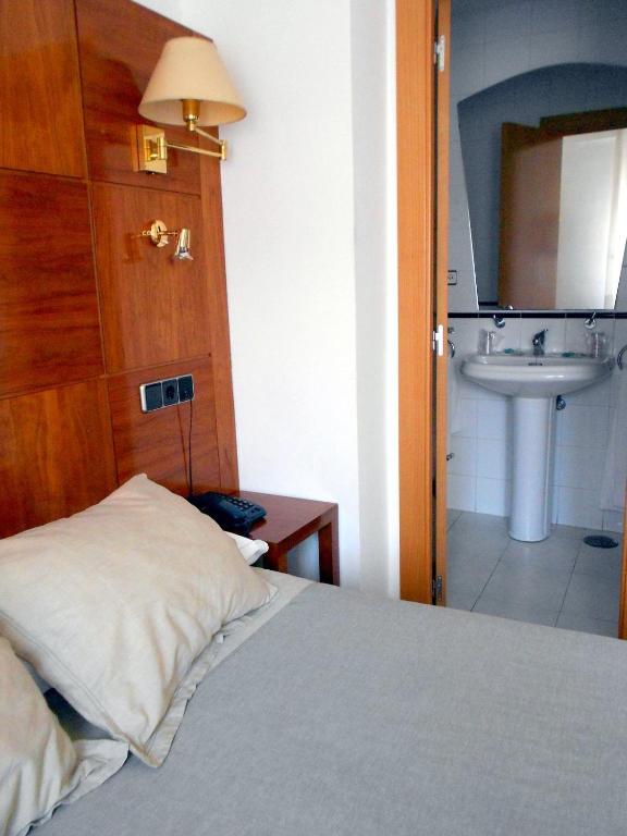 Postel nebo postele na pokoji v ubytování Hotel Trefacio