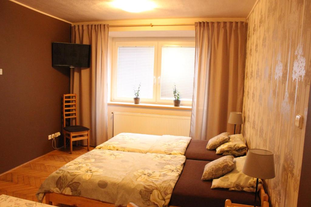 Postel nebo postele na pokoji v ubytování Ubytování U Morisse