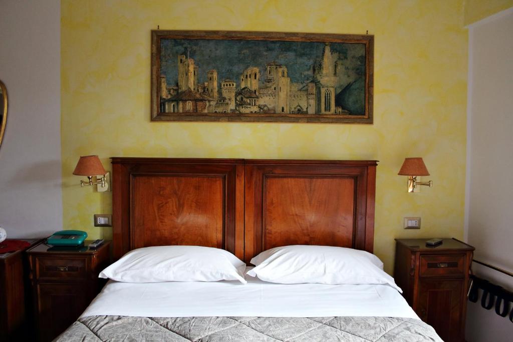 Postel nebo postele na pokoji v ubytování Primavera Mini Hotel