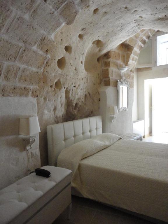 Postel nebo postele na pokoji v ubytování Caveoso Hotel