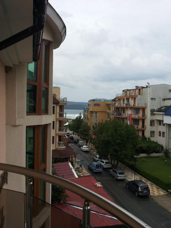 a view of a city street from a balcony at Family Hotel Golden Lion in Primorsko