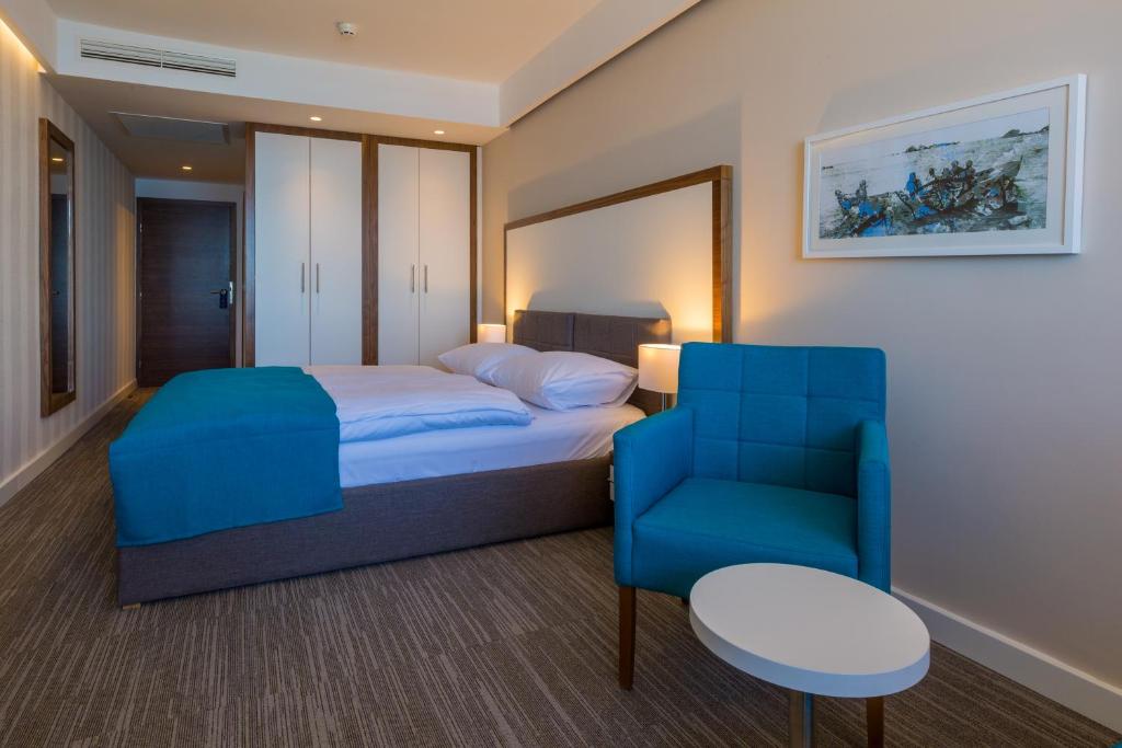 Een bed of bedden in een kamer bij Hotel Katarina