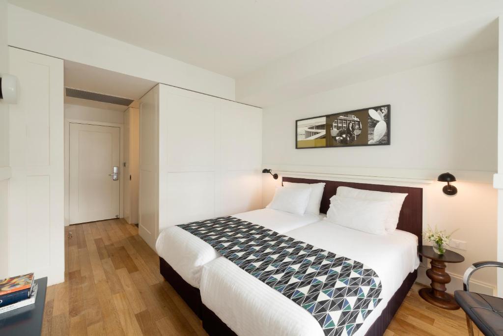 Postel nebo postele na pokoji v ubytování Lily & Bloom Boutique Hotel