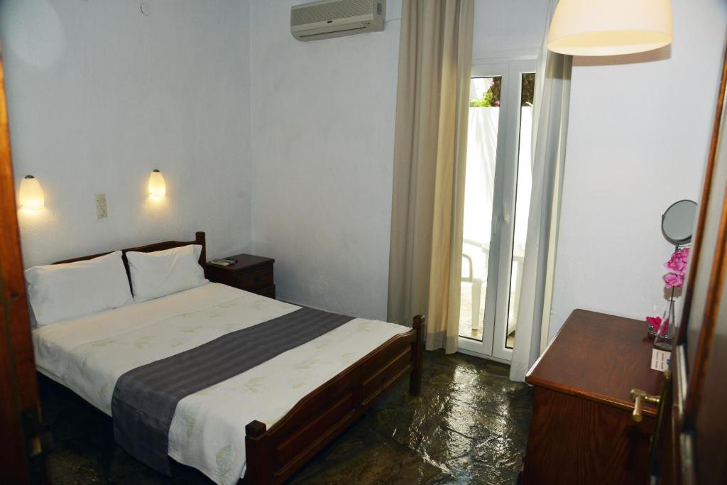 Postel nebo postele na pokoji v ubytování Hotel Anelli