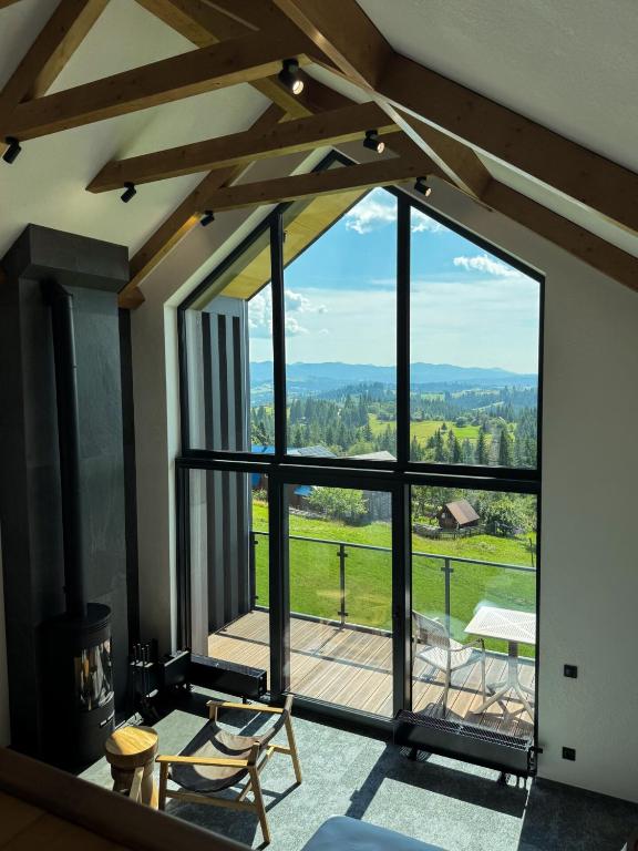 a room with a large window with a view at Charlton Estate in Yablunytsya