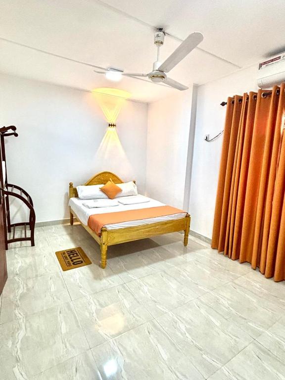 En eller flere senge i et værelse på Akshaya Villa Trincomalee