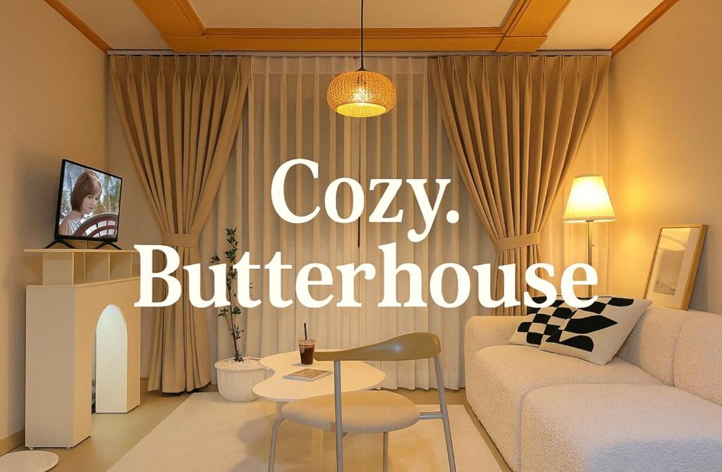a living room with a couch and a chair at COZY BUTTERHOUSE, Near Metro, Close to Airport, Hongdae, WIFI, Long Biz Trip, Local Vibe in Seoul