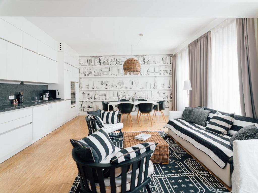 a living room with a couch and chairs and a table at my Home in Vienna - Erdberg Smart Apartments in Vienna