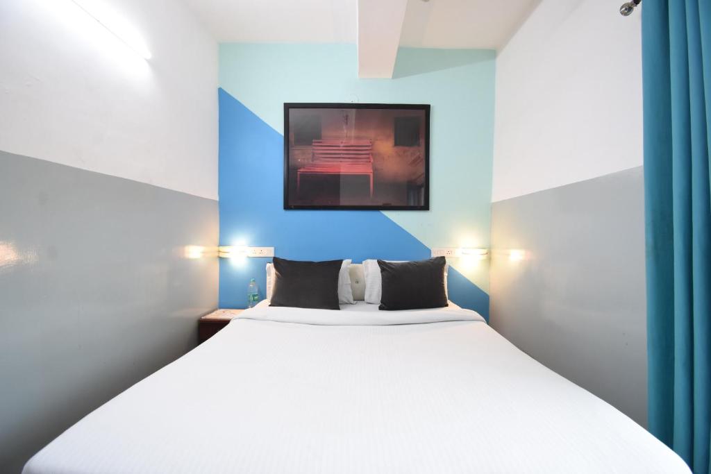 Postel nebo postele na pokoji v ubytování OYO 82026 BANGUR INN