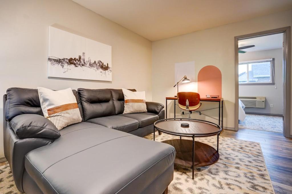 a living room with a couch and a table at Parking Pets Private Entrance Near Med Center in West Allis