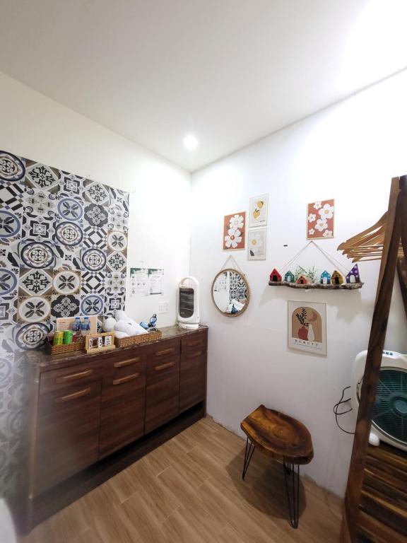 a room with a counter and a stool in it at Mây Nhà Tuii - Homestay in Da Lat in Ấp Ða Lợi