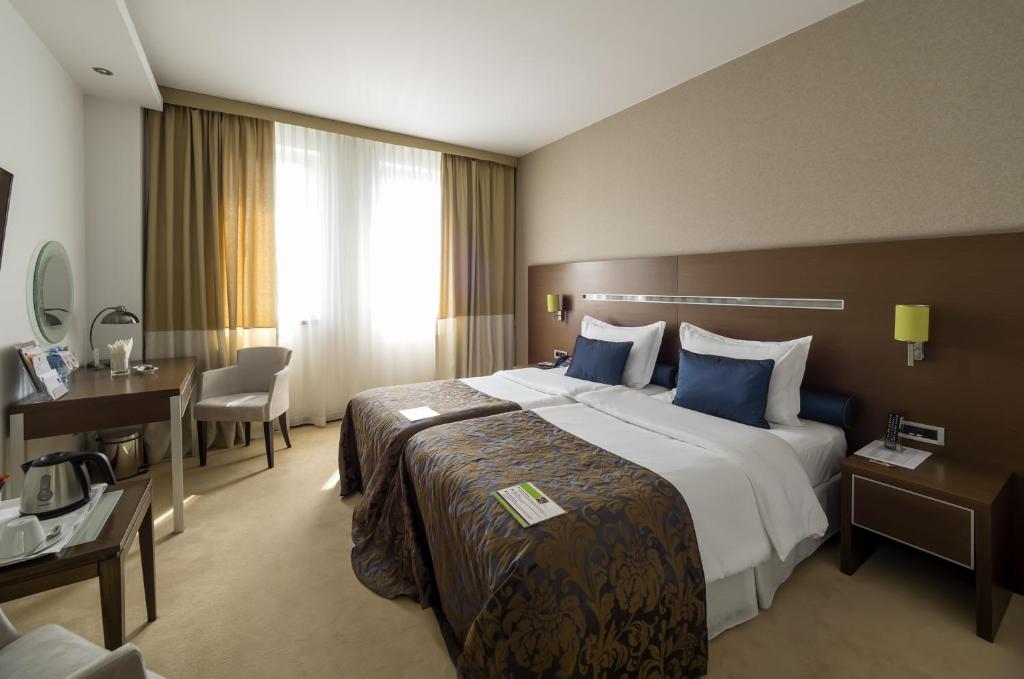Krevet ili kreveti u jedinici u okviru objekta IN Hotel Beograd