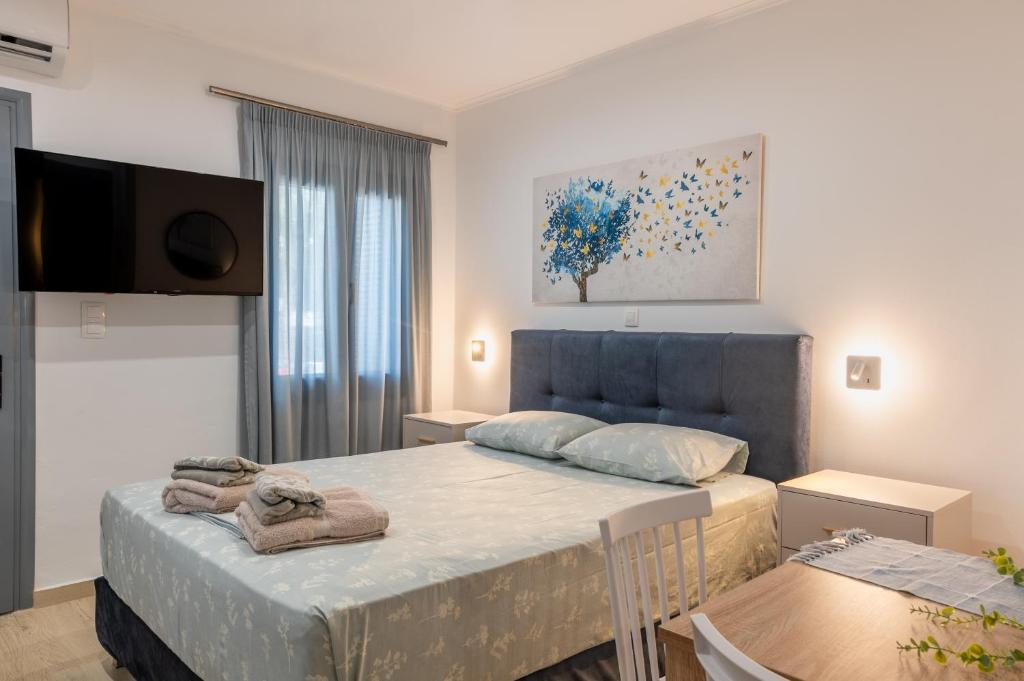 Postel nebo postele na pokoji v ubytování Myrina Retreat - Blue Horizon