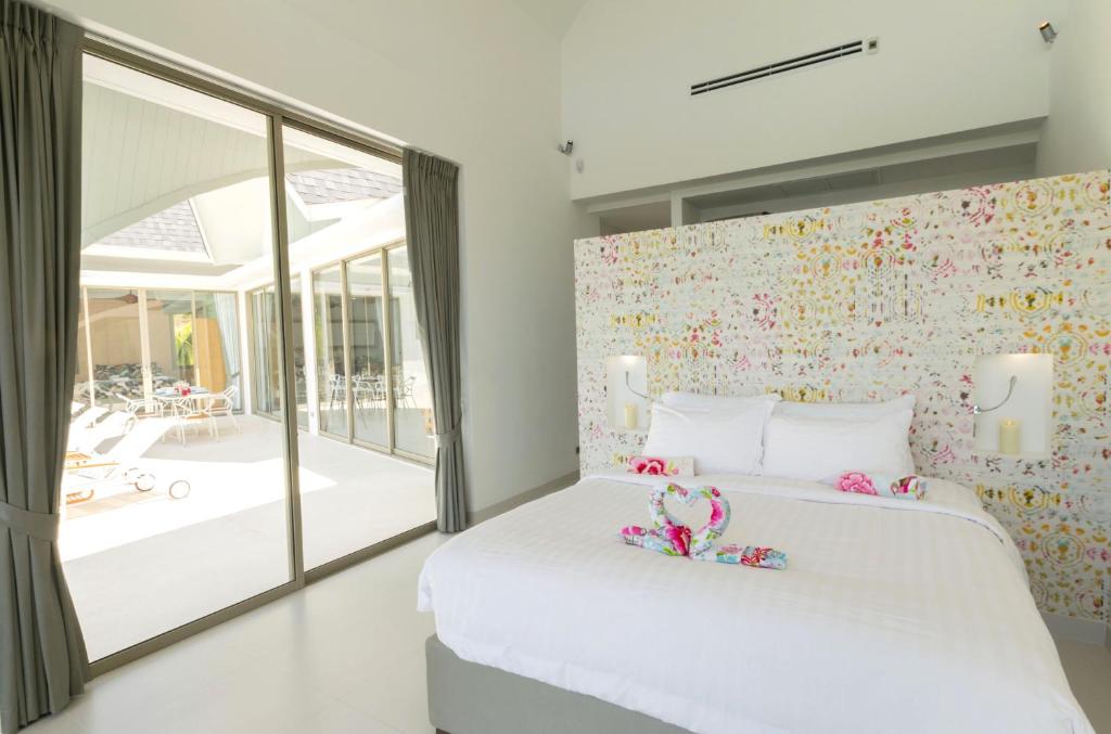 Postel nebo postele na pokoji v ubytování Villa Cocoon