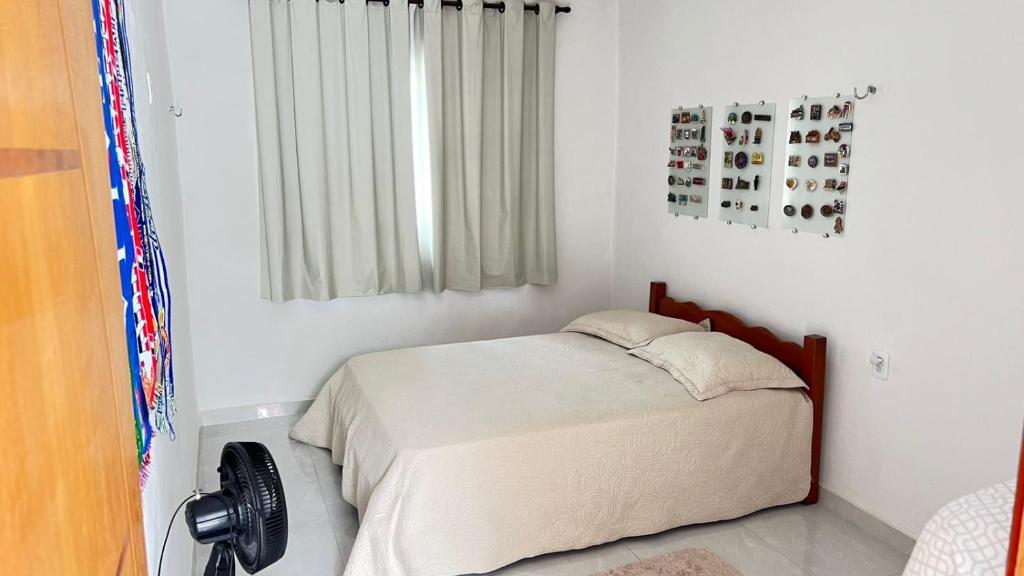 Ένα ή περισσότερα κρεβάτια σε δωμάτιο στο Apartamento Aconchegante com Varanda em Pesqueira