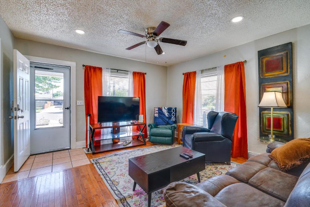 a living room with a couch and a flat screen tv at Extended Stay Home 3 Mi to Dtwn Pueblo in Pueblo
