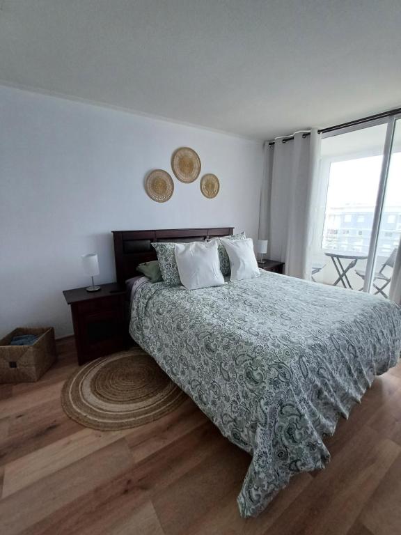 Ένα ή περισσότερα κρεβάτια σε δωμάτιο στο Departamento Condominio Serena Pacifico