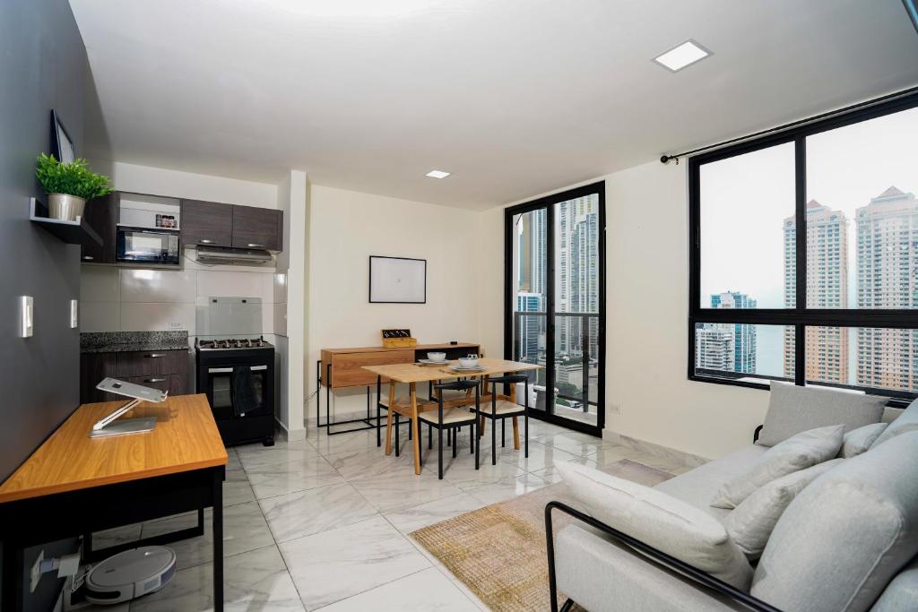 a living room with a couch and a table at 1BR Amazing sea view in Calle 50 in Panama City