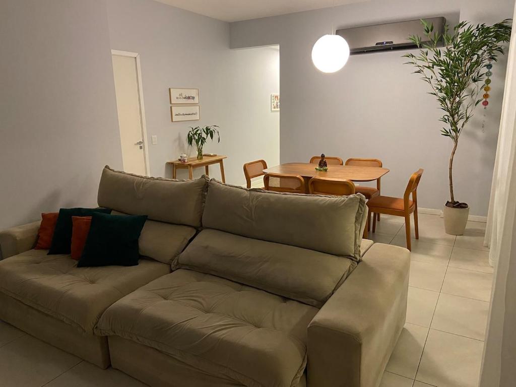 a living room with a couch and a table at Comfort in the Best Area of COP 30 in Belém