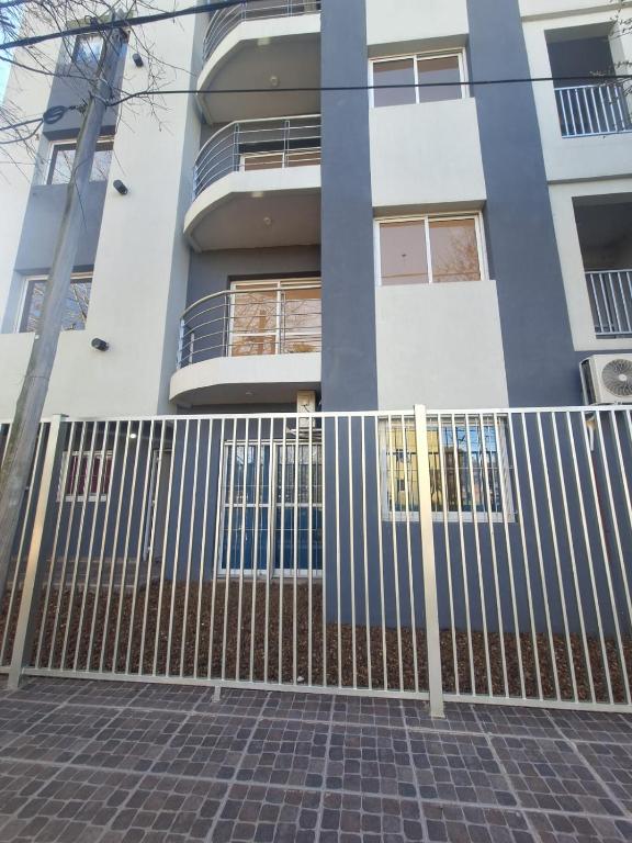 a house with a gate in front of it at Colon Parque y Playa 2 a 4 personas in Colón