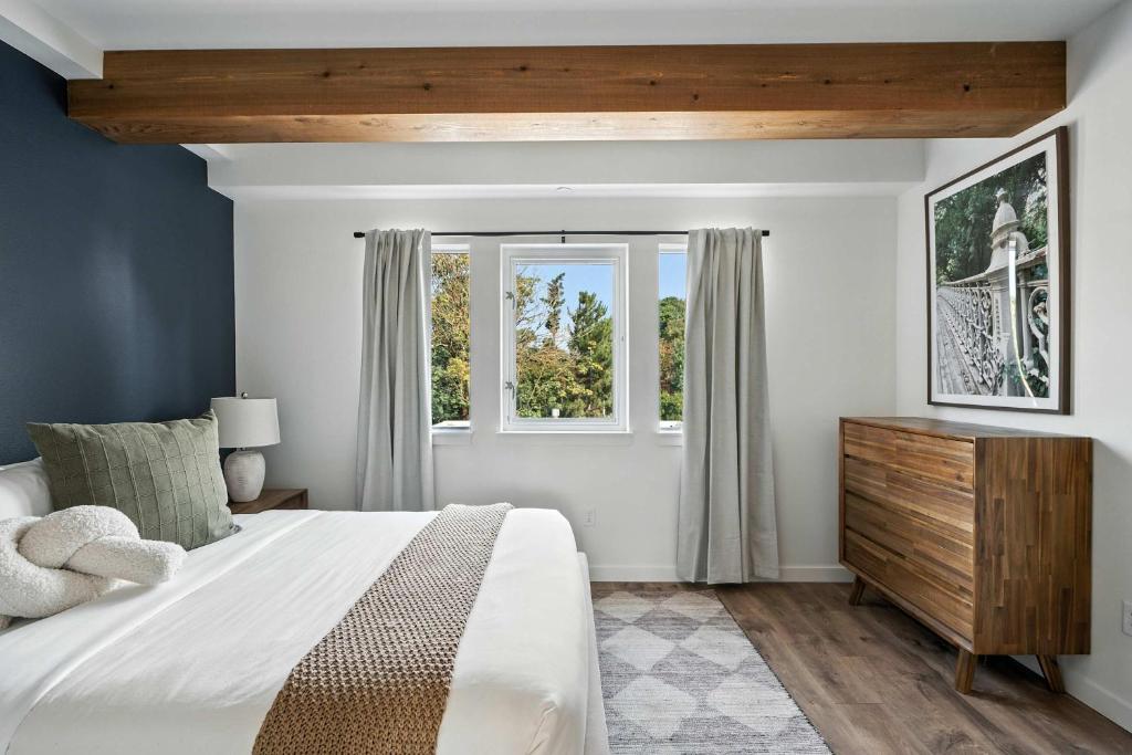a bedroom with a large bed and a window at The Adelynn - New Luxury Build in Center of PDX in Portland