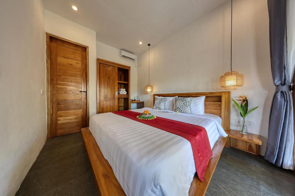 Кровать или кровати в номере Kampuak Cottages