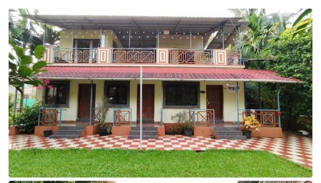 a house with a balcony on top of it at Paradise in Jāmb