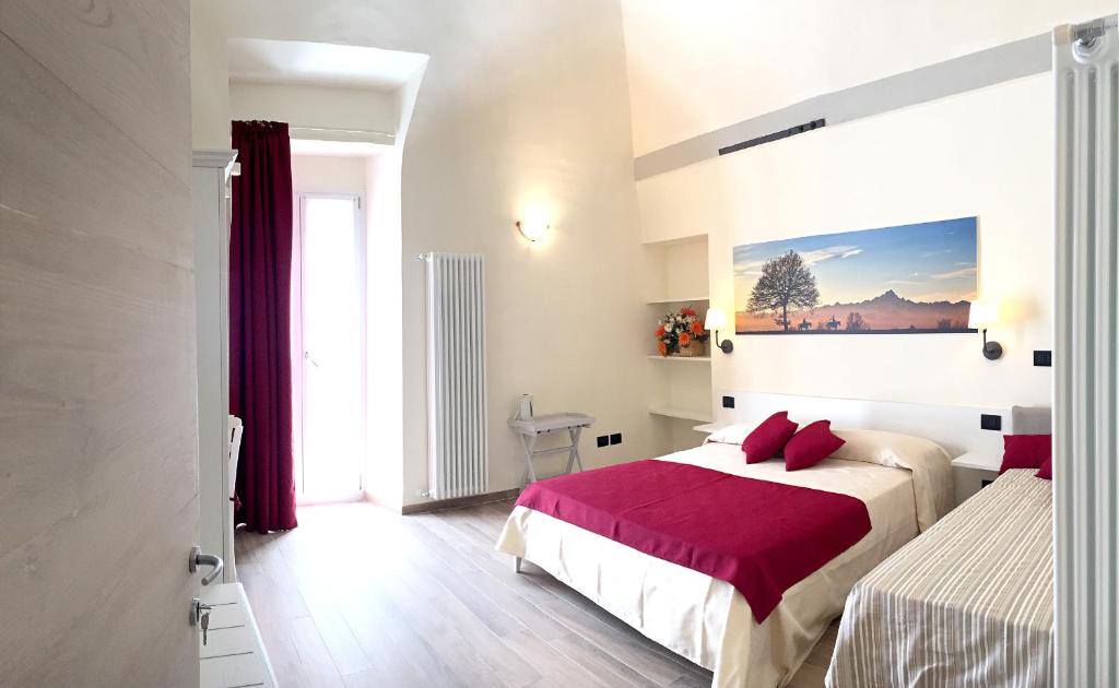 Postel nebo postele na pokoji v ubytování Osteria Senza Fretta Rooms for Rent