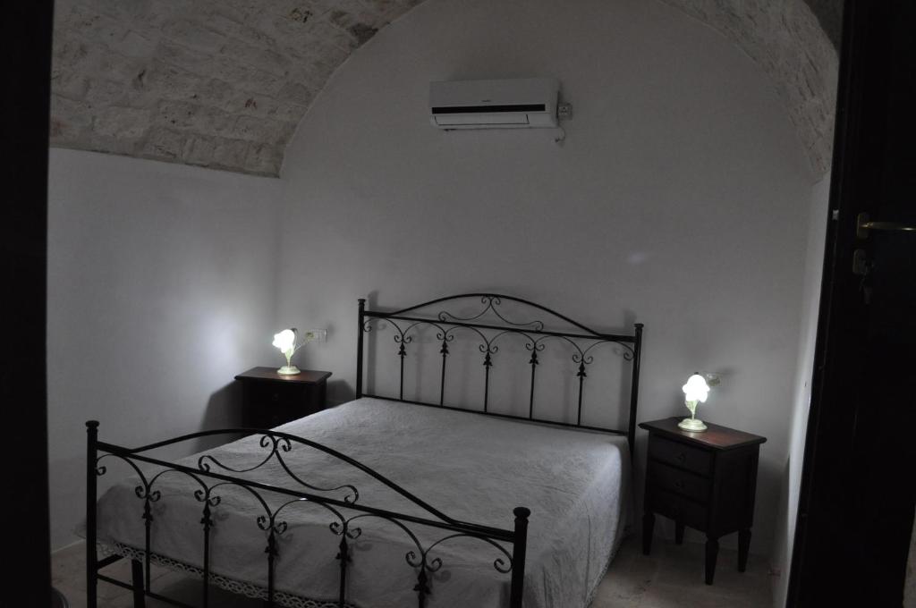 Postel nebo postele na pokoji v ubytování Masseria Costanza