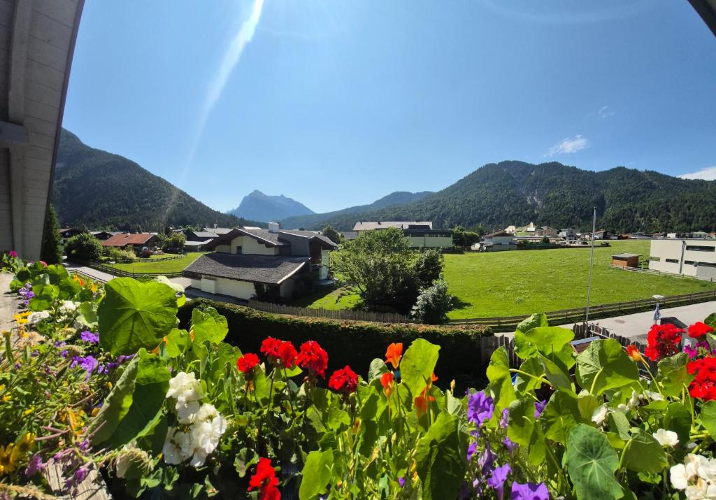 a view of a town with flowers at Ferienhaus Michael in Scharnitz