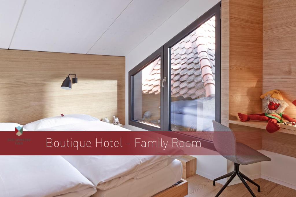 Postel nebo postele na pokoji v ubytování Boutique Hotel Schlossberg