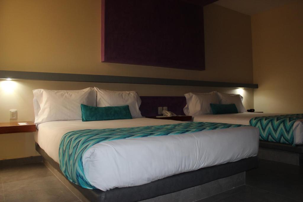 Postel nebo postele na pokoji v ubytování Orizaba Inn