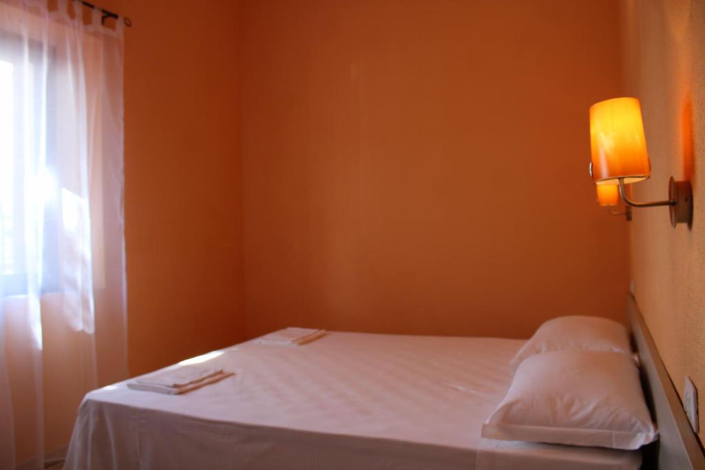 Letto o letti in una camera di B&B La Cantoniera