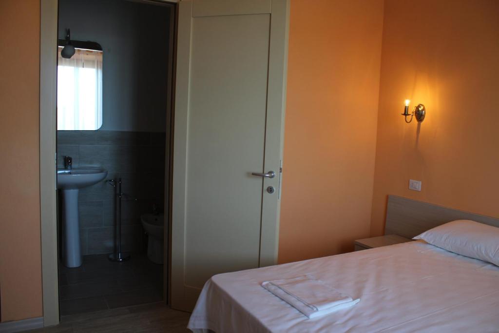 Letto o letti in una camera di B&B La Cantoniera