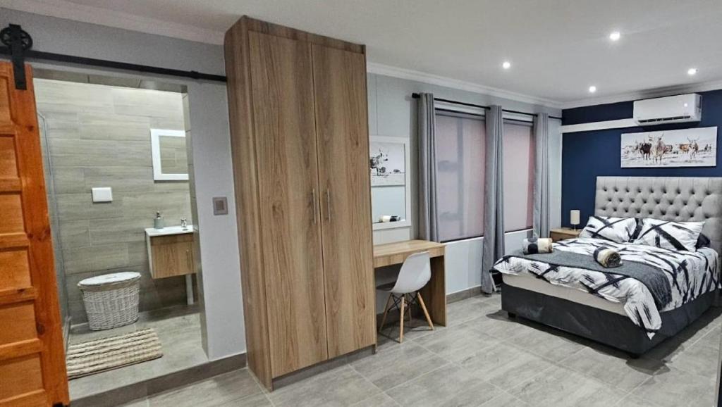 Ένα ή περισσότερα κρεβάτια σε δωμάτιο στο Nguni Self Catering