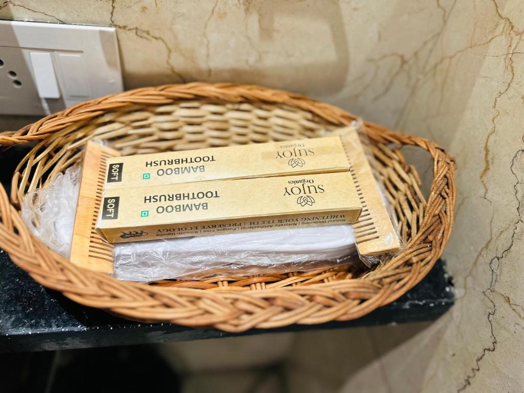 a basket filled with books on a table at Hotel Casa Inn in Indore