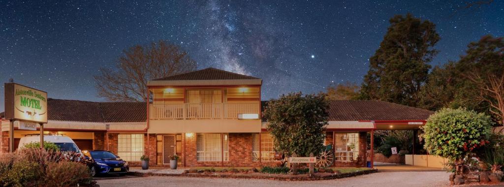 a building with the milky way in the sky at Alstonville Settlers Motel in Alstonville